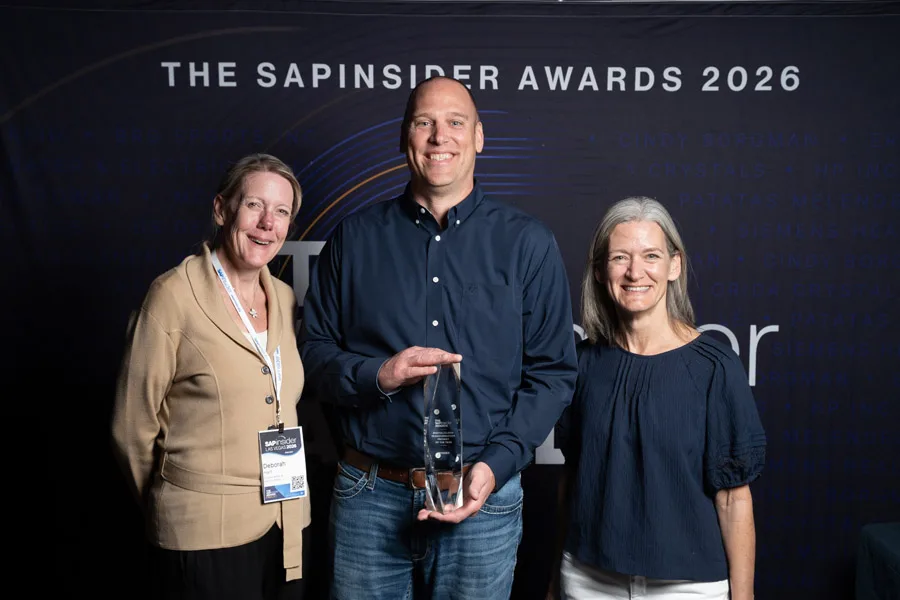 A winning team with their SAPinsider Awards trophy